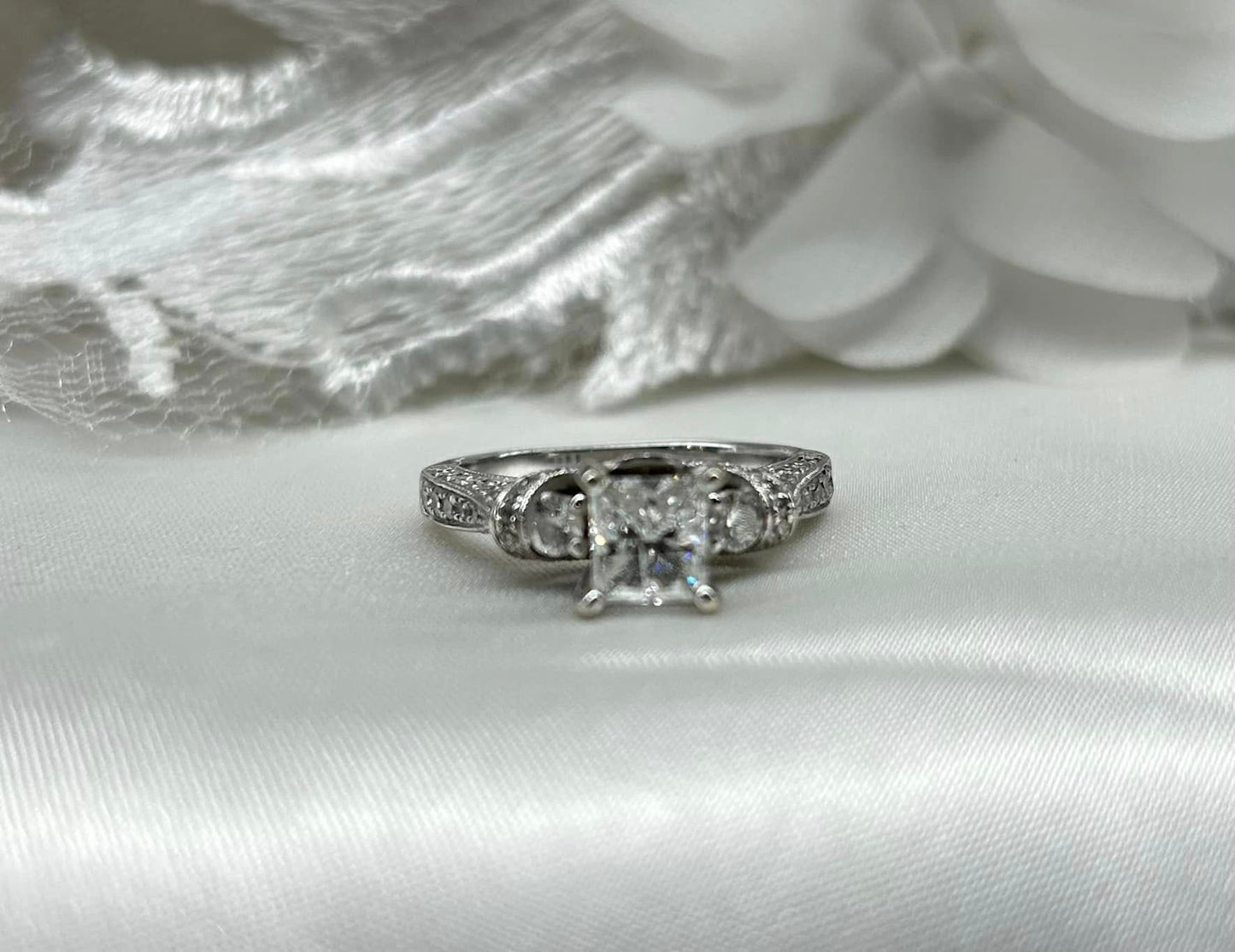 14KW Gold and Natural Diamond. Main Diamond is a 0.88ct H/I1.